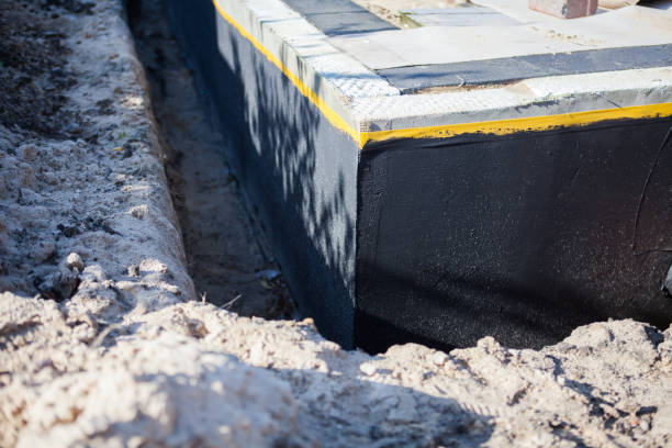 Professional Basement Waterproofing technician working in Pitsburg, OH